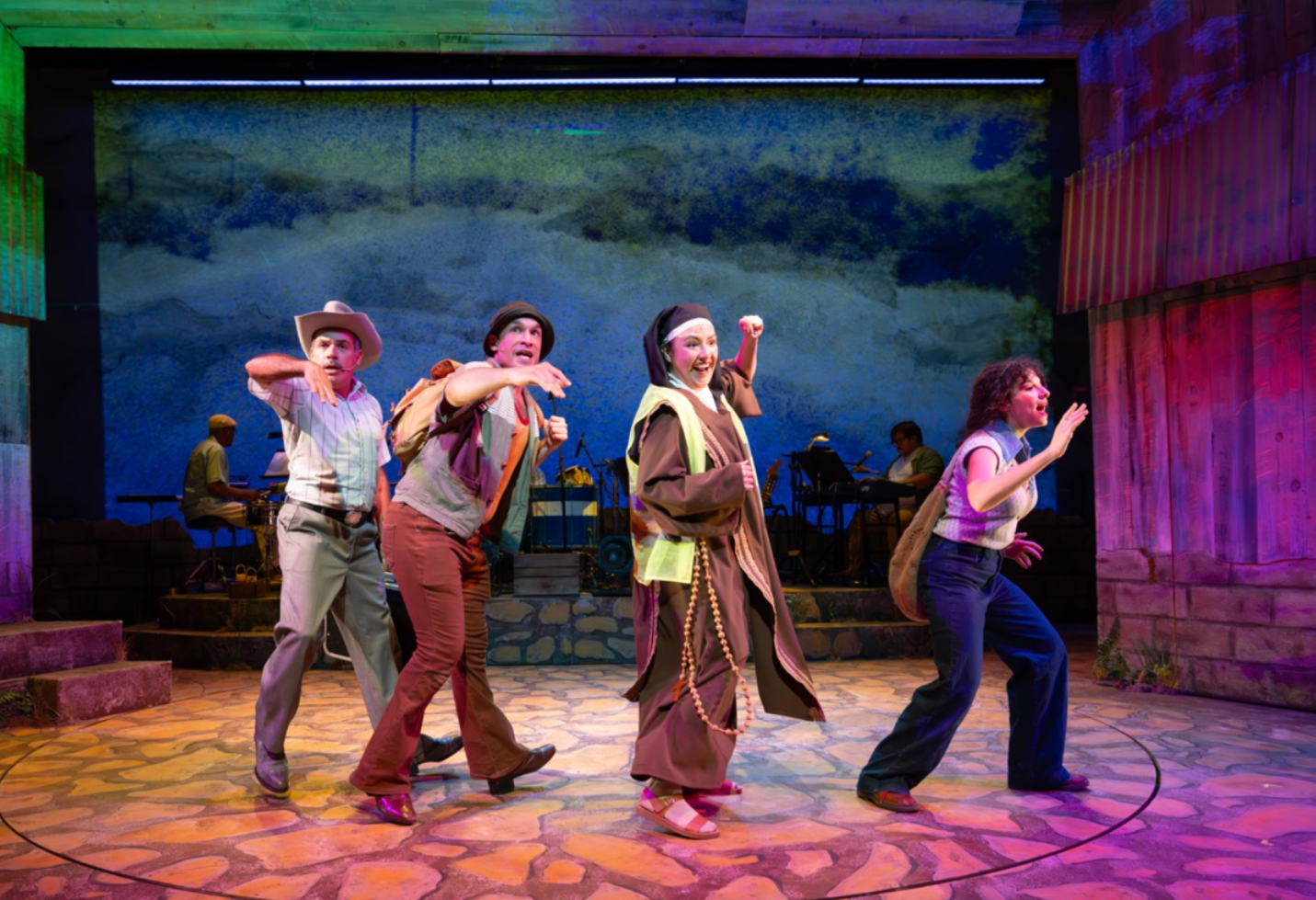 Ensemble cast in motion during a Trinity Repertory Theatre production